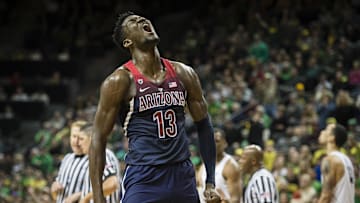 Feb 24, 2018; Eugene, OR, USA; Arizona Wildcats forward Deandre Ayton (13) shouts after a play during the second half against the Oregon Ducks at Matthew Knight Arena. Oregon won 98-93 in overtime. Mandatory Credit: Troy Wayrynen-Imagn Images