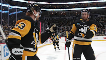 Feb 22, 2025; Pittsburgh, Pennsylvania, USA; Pittsburgh Penguins left wing Danton Heinen (43) is congratulated by right wing Kevin Hayes (13) after Heinen scored a goal against the Washington Capitals during the third period at PPG Paints Arena. Mandatory Credit: Charles LeClaire-Imagn Images