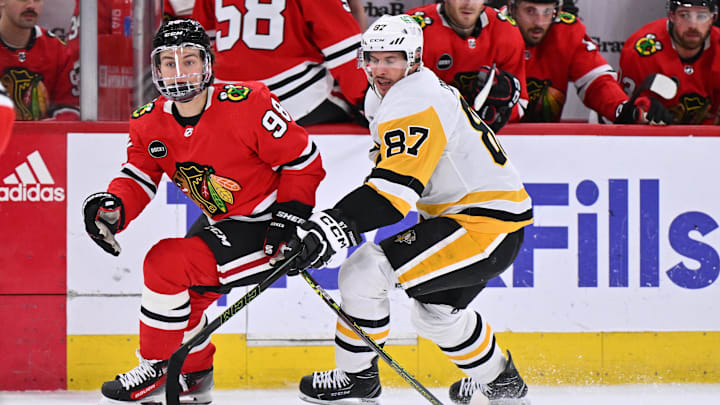 Feb 15, 2024; Chicago, Illinois, USA; Chicago Blackhawks forward Connor Bedard (98) and Pittsburgh Penguins forward Sidney Crosby (87) chase after a loose puck in the first period at United Center. Mandatory Credit: Jamie Sabau-Imagn Images Feb 15, 2024; Chicago, Illinois, USA; Chicago Blackhawks forward Connor Bedard (98) and Pittsburgh Penguins forward Sidney Crosby (87) chase after a loose puck in the first period at United Center. Mandatory Credit: Jamie Sabau-Imagn Images