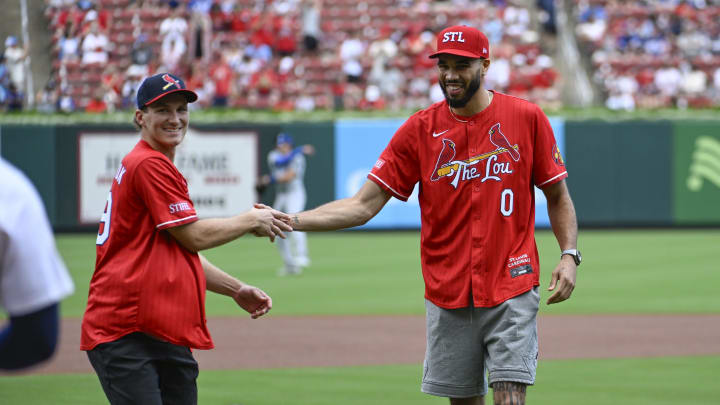 Aug 18, 2024; St. Louis, Missouri, USA; Florida Panthers right wing Matthew Tkachuk and Boston Celtics forward Jayson Tatum greet each other after throwing out a ceremonial first pitch prior to a game between the St. Louis Cardinals and the Los Angeles Dodgers  Busch Stadium. Mandatory Credit: Joe Puetz-USA TODAY Sports