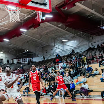 Pike Red Devils center Isaiah Hill (30) dunks the ball