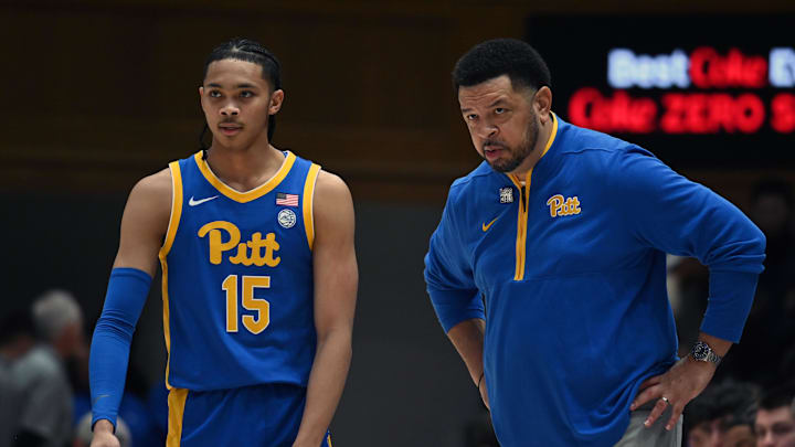 Jan 7, 2025; Durham, North Carolina, USA; Pitt Panthers head coach Jeff Capel (right) talks to guard Jaland Lowe (15) during the first half against the Duke Blue Devils at Cameron Indoor Stadium. Mandatory Credit: Rob Kinnan-Imagn Images