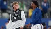 Oct 9, 2025; East Rutherford, New Jersey, USA; New York Giants quarterback Jaxson Dart, left, and quarterback Jameis Winston, right, on the field before the game against the Philadelphia Eagles at MetLife Stadium.  