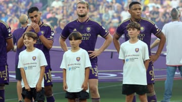 May 15, 2024; Orlando, Florida, USA;  Inter Miami CF midfielder Facundo Farias (11),  forward Duncan McGuire (13) and forward Luis Muriel (9) stand as they escort kids out for the National Anthem between the Inter Miami and the Orlando City at Inter&Co Stadium. Mandatory Credit: Kim Klement Neitzel-USA TODAY Sports