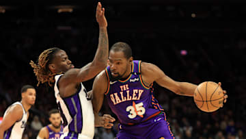 Mar 14, 2025; Phoenix, Arizona, USA; Phoenix Suns forward Kevin Durant (35) against Sacramento Kings guard Keon Ellis (23) at Footprint Center. Mandatory Credit: Mark J. Rebilas-Imagn Images