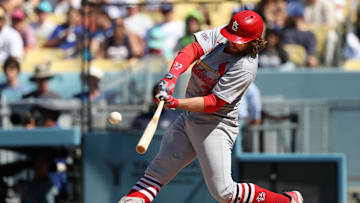 Aug 6, 2025; Los Angeles, California, USA;  St. Louis Cardinals second baseman Brendan Donovan (33) hits a single during the ninth inning against the Los Angeles Dodgers at Dodger Stadium. Mandatory Credit: Kiyoshi Mio-Imagn Images