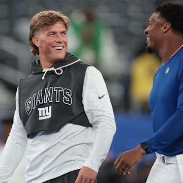Oct 9, 2025; East Rutherford, New Jersey, USA; New York Giants quarterback Jaxson Dart, left, and quarterback Jameis Winston, right, on the field before the game against the Philadelphia Eagles at MetLife Stadium.  