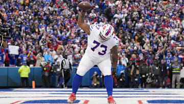 Nov 16, 2025; Orchard Park, New York, USA;  Buffalo Bills offensive tackle Dion Dawkins (73) celebrates Josh Allen’s first quarter touchdown