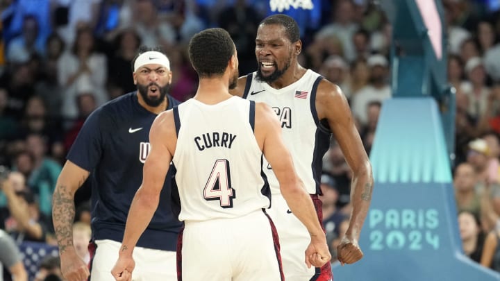 United States stars Kevin Durant and Stephen Curry celebrate during Team USA's win against Serbia in the Olympic semifinal.