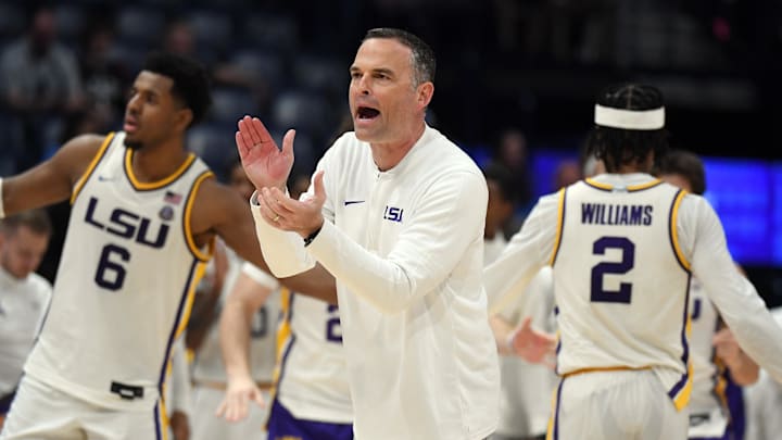 Mar 14, 2024; Nashville, TN, USA; LSU Tigers head coach Matt McMahon claps for his players during a timeout during the second half against the Mississippi State Bulldogs at Bridgestone Arena. Mandatory Credit: Christopher Hanewinckel-Imagn Images