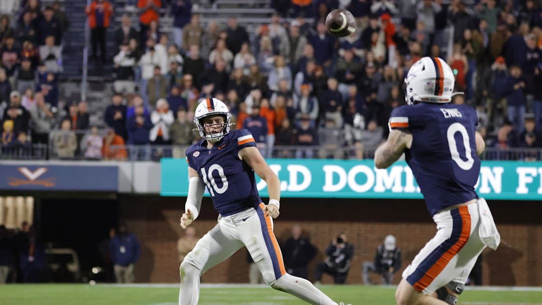 Nov 8, 2025; Charlottesville, Virginia, USA; Virginia Cavaliers quarterback Daniel Kaelin (10) passes the ball to Virginia Cavaliers tight end Sage Ennis (0) against the Wake Forest Demon Deacons during the second half at Scott Stadium. Mandatory Credit: Amber Searls-Imagn Images
