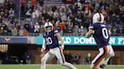 Nov 8, 2025; Charlottesville, Virginia, USA; Virginia Cavaliers quarterback Daniel Kaelin (10) passes the ball to Virginia Cavaliers tight end Sage Ennis (0) against the Wake Forest Demon Deacons during the second half at Scott Stadium. Mandatory Credit: Amber Searls-Imagn Images