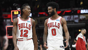 Jan 30, 2022; Chicago, Illinois, USA; Chicago Bulls guard Ayo Dosunmu (12) and Chicago Bulls guard Coby White (0) after the game against the Portland Trail Blazers at the United Center. Mandatory Credit: Matt Marton-Imagn Images