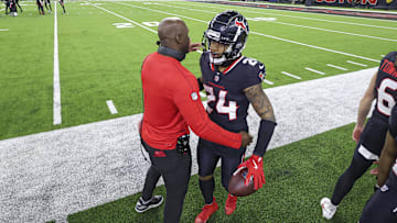 Jan 11, 2025; Houston, Texas, USA; Houston Texans head coach DeMeco Ryans embraces cornerback Derek Stingley Jr. (24) after a Stingley interception during the game against the Los Angeles Chargers in an AFC wild card game at NRG Stadium. Mandatory Credit: Troy Taormina-Imagn Images