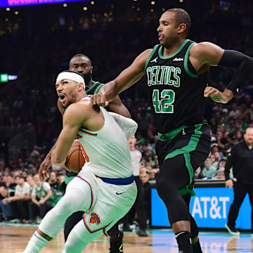 May 14, 2025; Boston, Massachusetts, USA; New York Knicks guard Josh Hart (3) loses his balance while Boston Celtics center Al Horford (42) defends in the first half during game five of the second round for the 2025 NBA Playoffs at TD Garden. Mandatory Credit: Bob DeChiara-Imagn Images