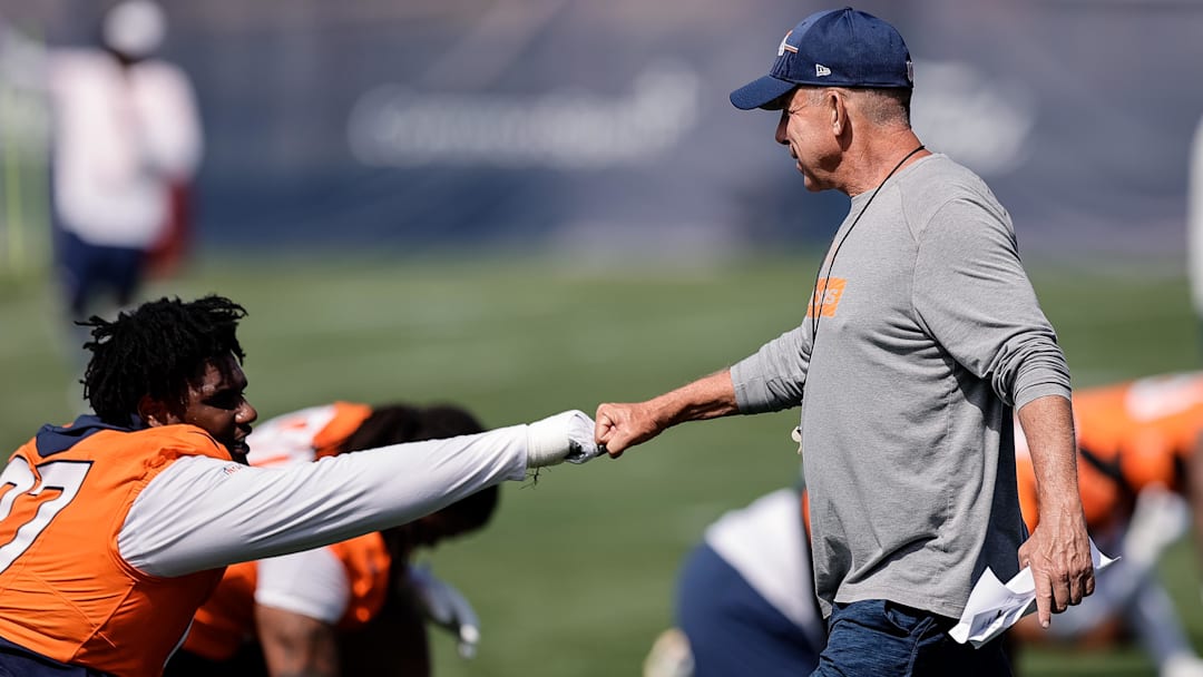 Jul 23, 2025; Englewood, CO, USA; Denver Broncos head coach Sean Payton and defensive tackle Malcolm Roach (97) during Denver Broncos Training Camp. 