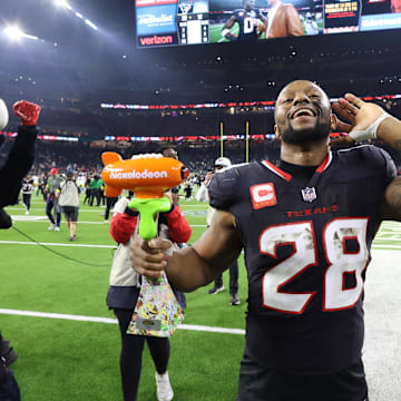 Jan 11, 2025; Houston, Texas, USA; Houston Texans running back Joe Mixon (28) walks off the field after the win against the Los Angeles Chargers in an AFC wild card game at NRG Stadium. Mandatory Credit: Troy Taormina-Imagn Images