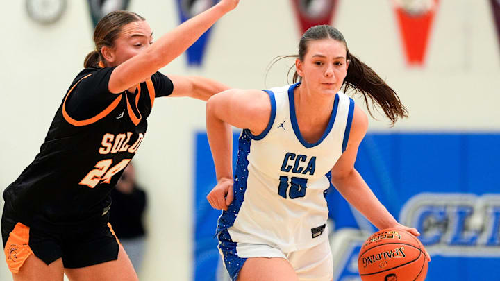 Clear Creek Amana’s Averie Lower (10) dribbles the ball as Solon’s Jerzey Haluska (24) defends Dec. 5, 2025 during a girls basketball game in Tiffin, Iowa.