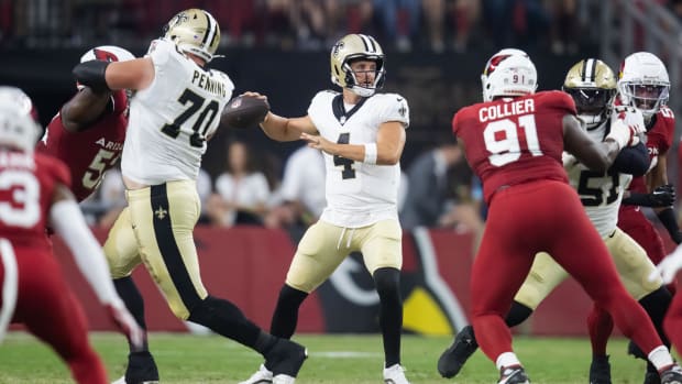 New Orleans Saints quarterback Derek Carr (4) throws against the Arizona Cardinals 