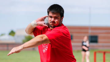 Jackson Cantwell spins around as he practices throwing a shotput during track and field practice at Nixa High School on Wednesday, April 24, 2024.