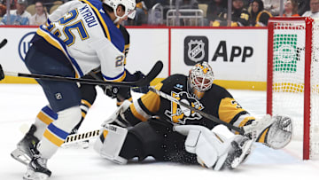 Mar 13, 2025; Pittsburgh, Pennsylvania, USA;  Pittsburgh Penguins goaltender Tristan Jarry (35) makes as save against St. Louis Blues center Jordan Kyrou (25) during the second period at PPG Paints Arena. Mandatory Credit: Charles LeClaire-Imagn Images