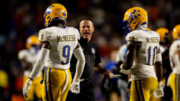 Sep 9, 2023; Gainesville, Florida, USA; McNeese State Cowboys head coach Gary Goff talks with McNeese State Cowboys defensive back Jadden Matthews (9) and McNeese State Cowboys defensive back Jaylen Jackson (10).