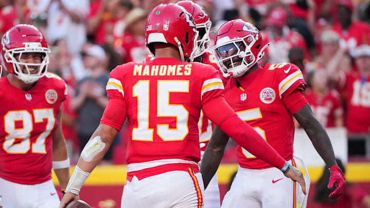 Sep 28, 2025; Kansas City, Missouri, USA; Kansas City Chiefs wide receiver Hollywood Brown (5) celebrates with Kansas City Chiefs quarterback Patrick Mahomes (15) after scoring a touchdown during the fourth quarter against the Baltimore Ravens at GEHA Field at Arrowhead Stadium. Mandatory Credit: Denny Medley-Imagn Images