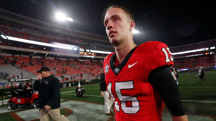 Georgia quarterback Carson Beck (15) heads to the locker room after wining a NCAA college football game against Ole Miss in Athens, Ga., on Saturday, Nov. 11, 2023. Georgia won 52-17.