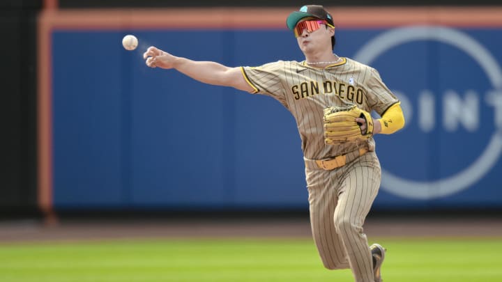Jun 16, 2024; New York City, New York, USA; San Diego Padres shortstop Ha-Seong Kim (7) fields a ground ball and throws to first base for an out during the sixth inning against the New York Mets at Citi Field. Mandatory Credit: John Jones-USA TODAY Sports