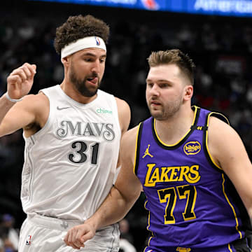 Apr 9, 2025; Dallas, Texas, USA; Dallas Mavericks guard Klay Thompson (31) and Los Angeles Lakers guard Luka Doncic (77) in action during the game between the Dallas Mavericks and the Los Angeles Lakers at American Airlines Center. Mandatory Credit: Jerome Miron-Imagn Images