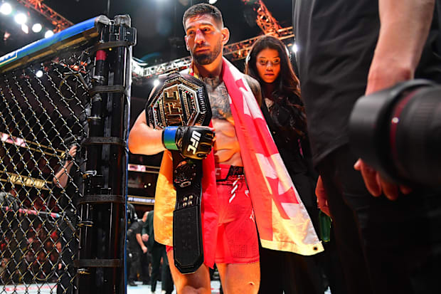 Ilia Topuria celebrates his championship victory against Alexander Volkanovski during UFC 298 at Honda Center. 