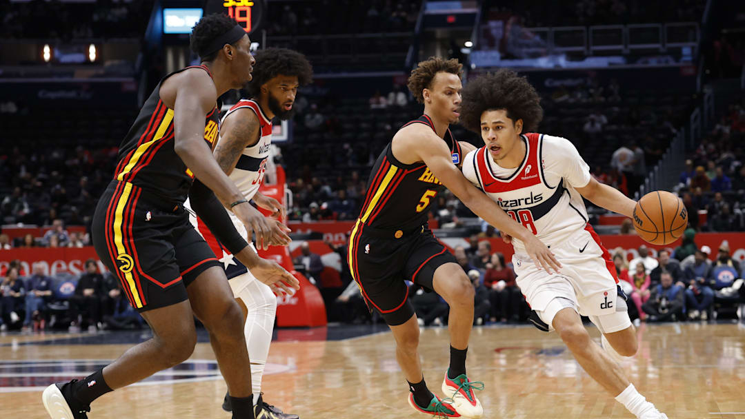 Dec 6, 2025; Washington, District of Columbia, USA; Washington Wizards forward Kyshawn George (18) drives to the basket as Atlanta Hawks guard Dyson Daniels (5) defends in the first half at Capital One Arena. Mandatory Credit: Geoff Burke-Imagn Images Dec 6, 2025; Washington, District of Columbia, USA; Washington Wizards forward Kyshawn George (18) drives to the basket as Atlanta Hawks guard Dyson Daniels (5) defends in the first half at Capital One Arena. Mandatory Credit: Geoff Burke-Imagn Images