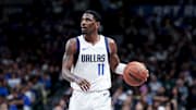 Feb 27, 2025; Dallas, Texas, USA;  Dallas Mavericks guard Kyrie Irving (11) controls the ball against the Charlotte Hornets during the second half at American Airlines Center. Mandatory Credit: Kevin Jairaj-Imagn Images