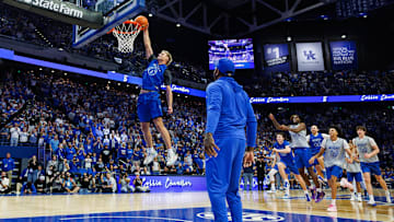 Oct 11, 2025; Lexington, KY, USA; Kentucky Wildcats guard Collin Chandler (5) gets an assist from former Kentucky Wildcat and NBA player John Wall as he competes in the dunk contest during Big Blue Madness at Rupp Arena at Central Bank Center. Mandatory Credit: Jordan Prather-Imagn Images