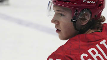 Team ROC forward Arseni Gritsyuk (81) kneels on the ice during warmups. Credit: George Walker IV-Imagn Images