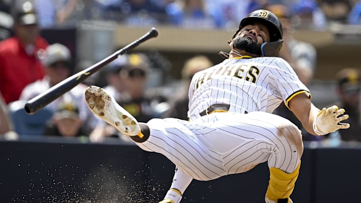 Apr 16, 2025; San Diego, California, USA; San Diego Padres right fielder Fernando Tatis Jr. (23) dodges a pitch during the seventh inning against the Chicago Cubs at Petco Park. Mandatory Credit: Denis Poroy-Imagn Images