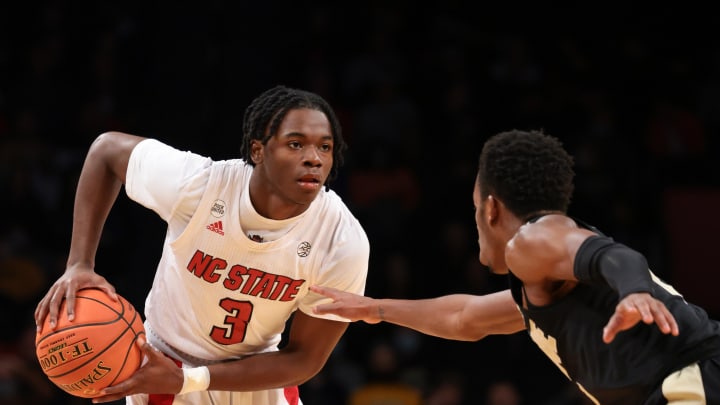 Dec 12, 2021; Brooklyn, New York, USA; North Carolina State Wolfpack guard Cam Hayes (3) shields the