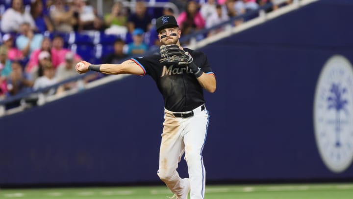 Aug 23, 2024; Miami, Florida, USA; Miami Marlins third baseman Connor Norby (24) throws to first base to retire Chicago Cubs first baseman Michael Busch (not pictured) during the seventh inning at loanDepot Park. 