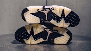 Outsoles of the A Ma Maniére x Air Jordan 6 "Smoky Mauve" colorway.