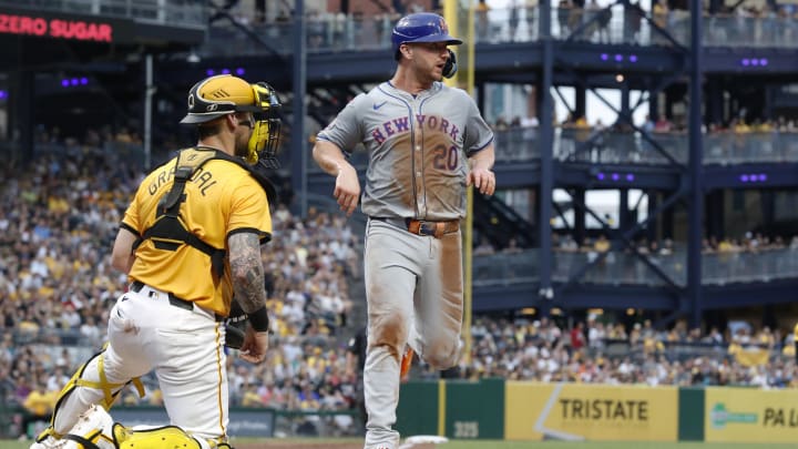 Jul 5, 2024; Pittsburgh, Pennsylvania, USA;  New York Mets first baseman Pete Alonso (20) cross home plate to score a run against the Pittsburgh Pirates during the fourth inning at PNC Park.