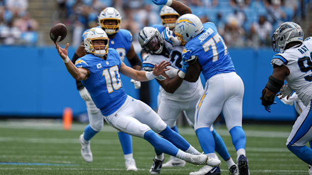 Sep 15, 2024; Charlotte, North Carolina, USA; Los Angeles Chargers quarterback Justin Herbert (10) throws under pressure.