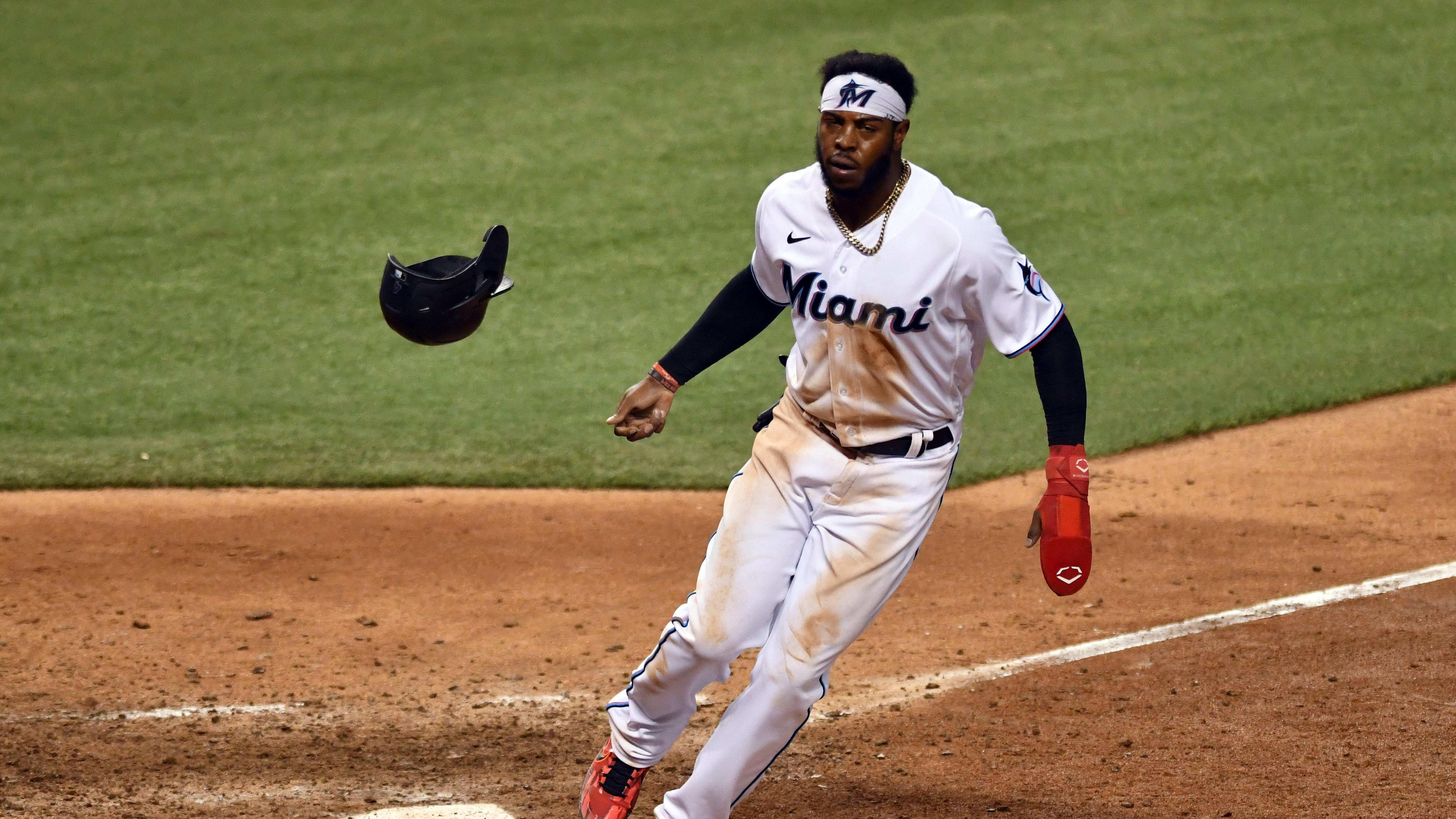 Sep 10, 2020; Miami, Florida, USA; Miami Marlins center fielder Monte Harrison (4) flips his helmet at home plate.