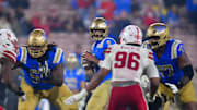 Nov 8, 2025; Pasadena, California, USA; UCLA Bruins quarterback Nico Iamaleava (9) drops back to pass against the Nebraska Cornhuskers during the second half at the Rose Bowl. Mandatory Credit: Gary A. Vasquez-Imagn Images