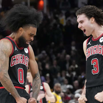 Mar 27, 2025; Chicago, Illinois, USA; Chicago Bulls guard Coby White (0) celebrates his three point basket against the Los Angeles Lakers with guard Josh Giddey (3) during the second half at United Center. Mandatory Credit: David Banks-Imagn Images