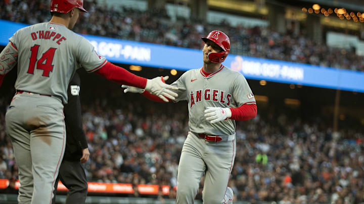 Jun 14, 2024; San Francisco, California, USA; Los Angeles Angels designated hitter Taylor Ward (3) gets a congratulatory handshake from teammate Logan O'Hoppe (14) as he scores on a double by Kevin Pillar during the third inning against the San Francisco Giants at Oracle Park. Mandatory Credit: D. Ross Cameron-USA TODAY Sports Jun 14, 2024; San Francisco, California, USA; Los Angeles Angels designated hitter Taylor Ward (3) gets a congratulatory handshake from teammate Logan O'Hoppe (14) as he scores on a double by Kevin Pillar during the third inning against the San Francisco Giants at Oracle Park. Mandatory Credit: D. Ross Cameron-USA TODAY Sports