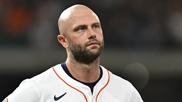 Christian Walker of Houston Astros walks off field