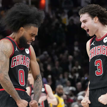 Mar 27, 2025; Chicago, Illinois, USA; Chicago Bulls guard Coby White (0) celebrates his three point basket against the Los Angeles Lakers with guard Josh Giddey (3) during the second half at United Center. Mandatory Credit: David Banks-Imagn Images