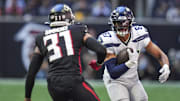 Oct 20, 2024; Atlanta, Georgia, USA; Seattle Seahawks tight end Noah Fant (87) runs against Atlanta Falcons safety Justin Simmons (31) during the first half at Mercedes-Benz Stadium. Mandatory Credit: Dale Zanine-Imagn Images