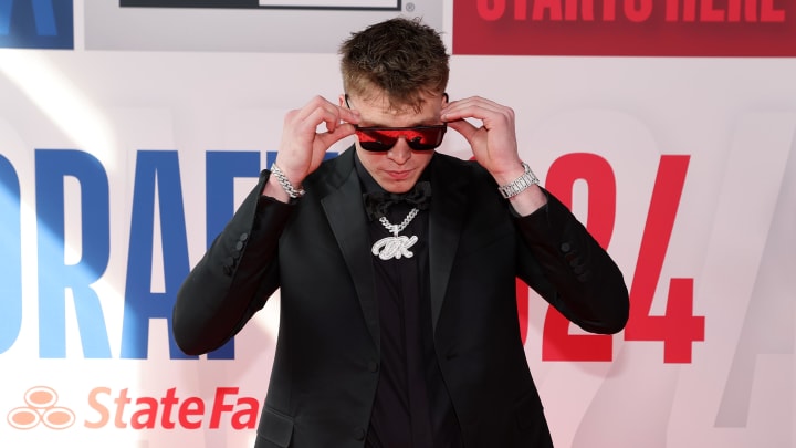Jun 26, 2024; Brooklyn, NY, USA; Dalton Knecht arrives for the first round of the 2024 NBA Draft at Barclays Center. Mandatory Credit: Brad Penner-USA TODAY Sports