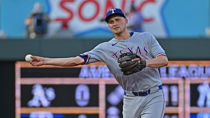 Texas Rangers shortstop Corey Seager (5) throws to first base in the fourth inning against the Kansas City Royals at Kauffman Stadium.